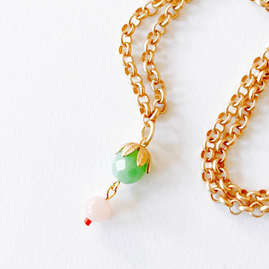 Nest Pretty Things | Thick Gold Rose Quartz necklace | A green and pink beaded pendant with a gold chain.