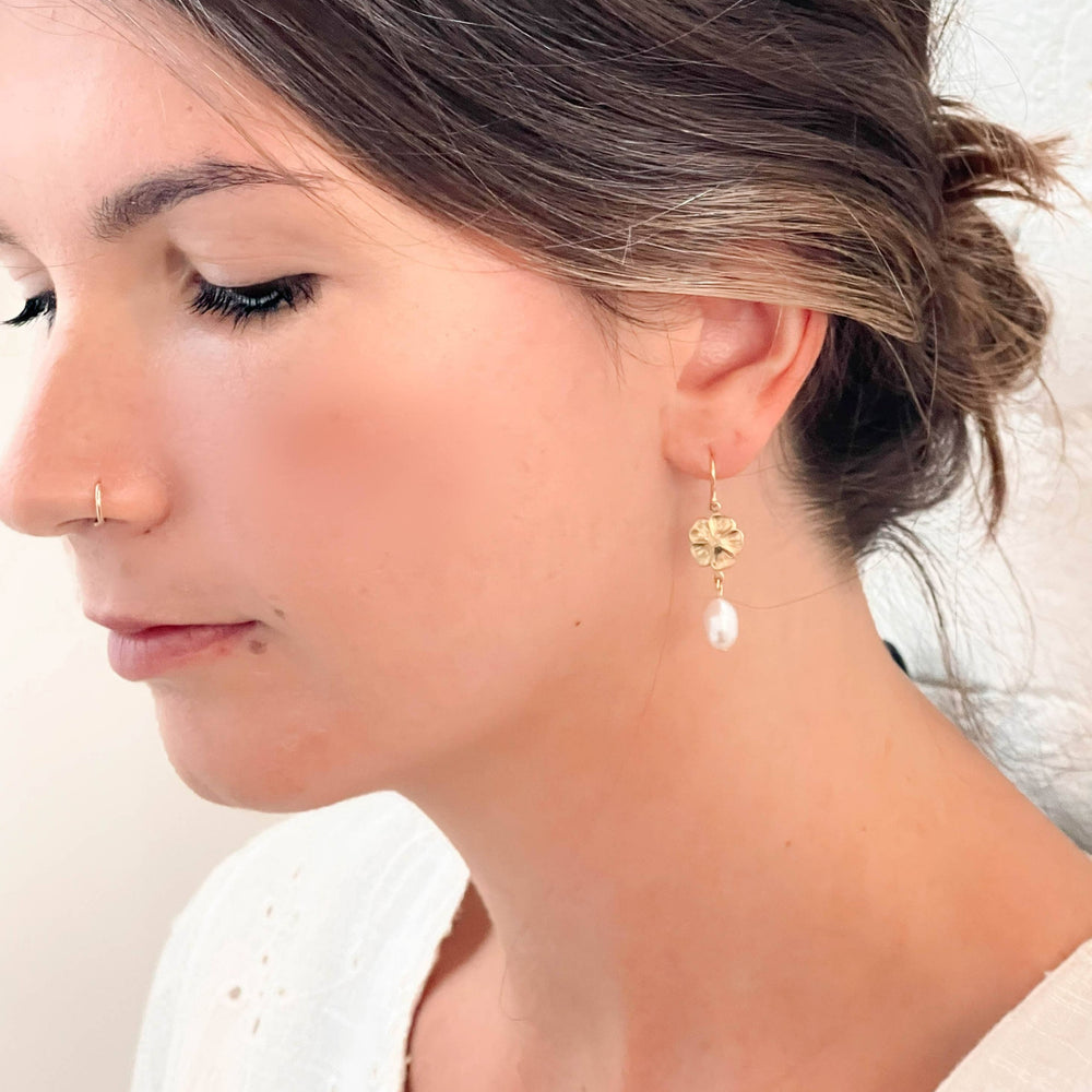 Nest Pretty Things | Flower And Pearl Dangle Earrings | The earring on a model for scale reference.