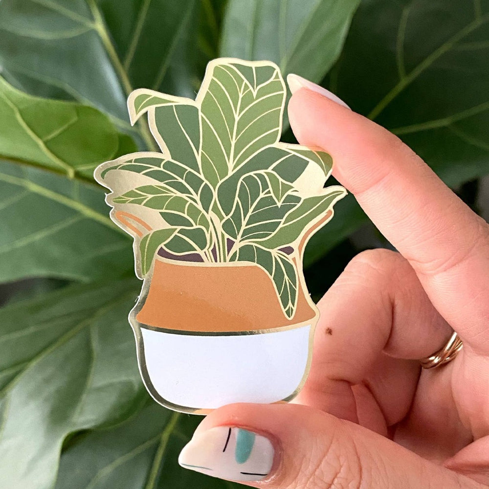 Paper Anchor Co.| Banana Leaf Sticker | Luxe Metallic Gold Sticker | A banana leaf plant in a white/orange pot with gold accents.