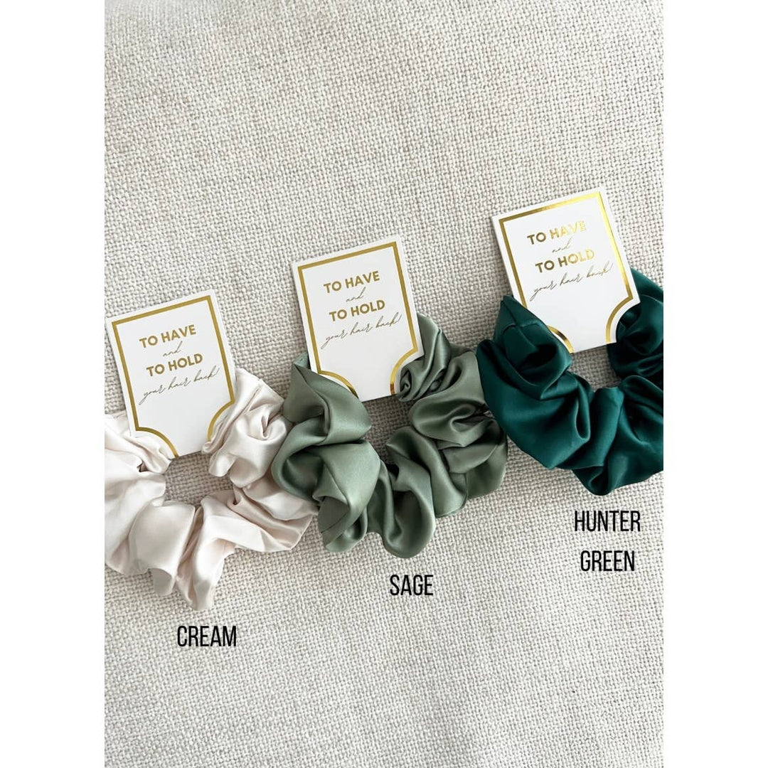 LoveLina Grace Silk Satin Soft Scrunchies | Assorted Colors | A variety of blue scrunchies with tags that read "TO HAVE and TO HOLD your hair back".