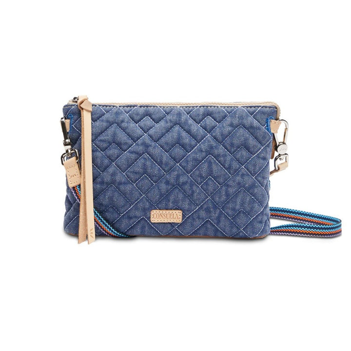 Abby Midtown Crossbody | Consuela | A denim blue quilted crossbody bag with a geometric pattern, multicolored strap and Diego leather accents.