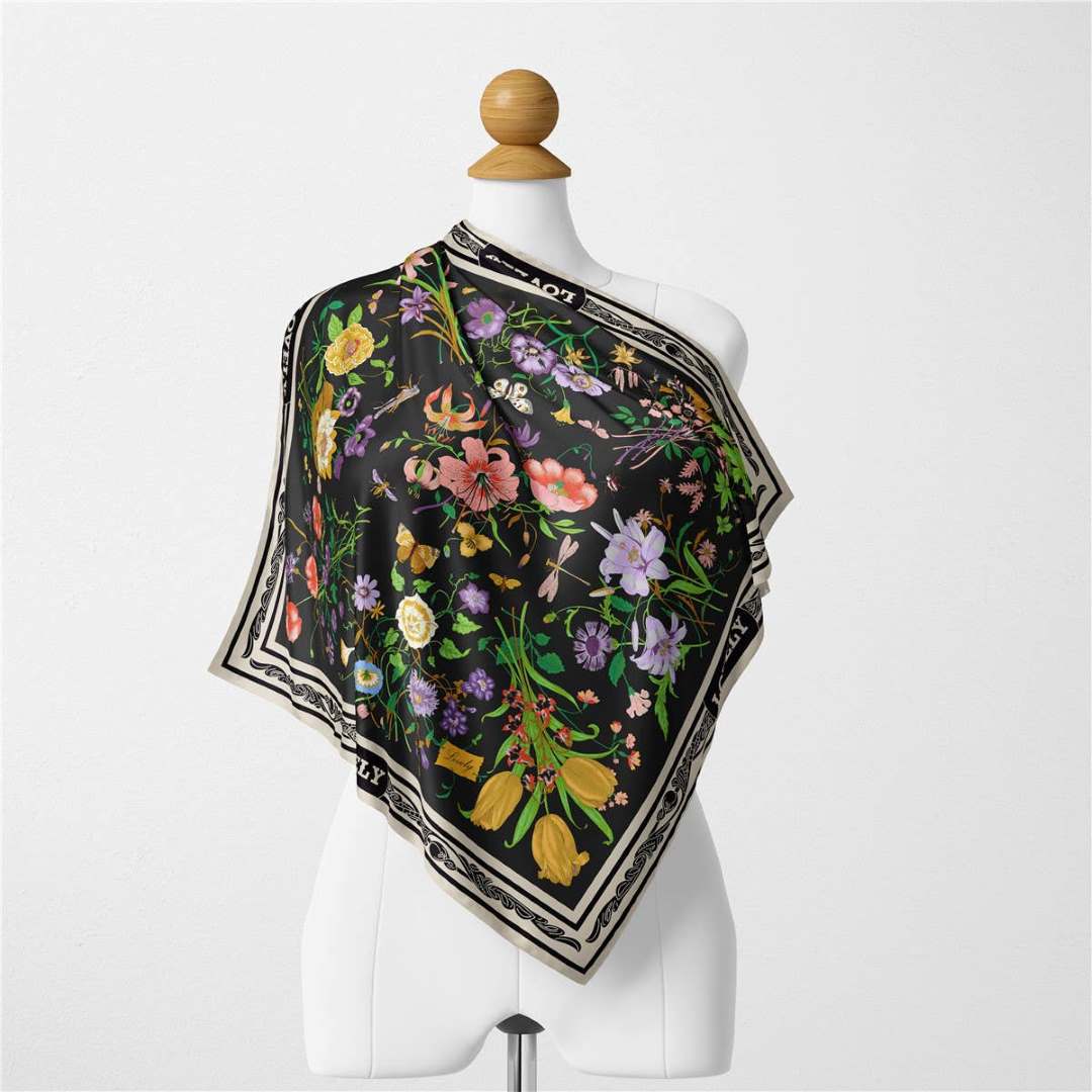 Accity Floral Neck Scarf | Black base with a bright floral pattern.