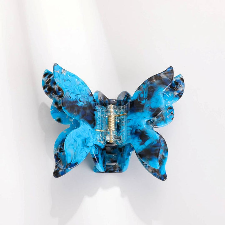 Adorro | Blue Butterfly Clips | Marbled blue and black clip in the shape of a butterfly.