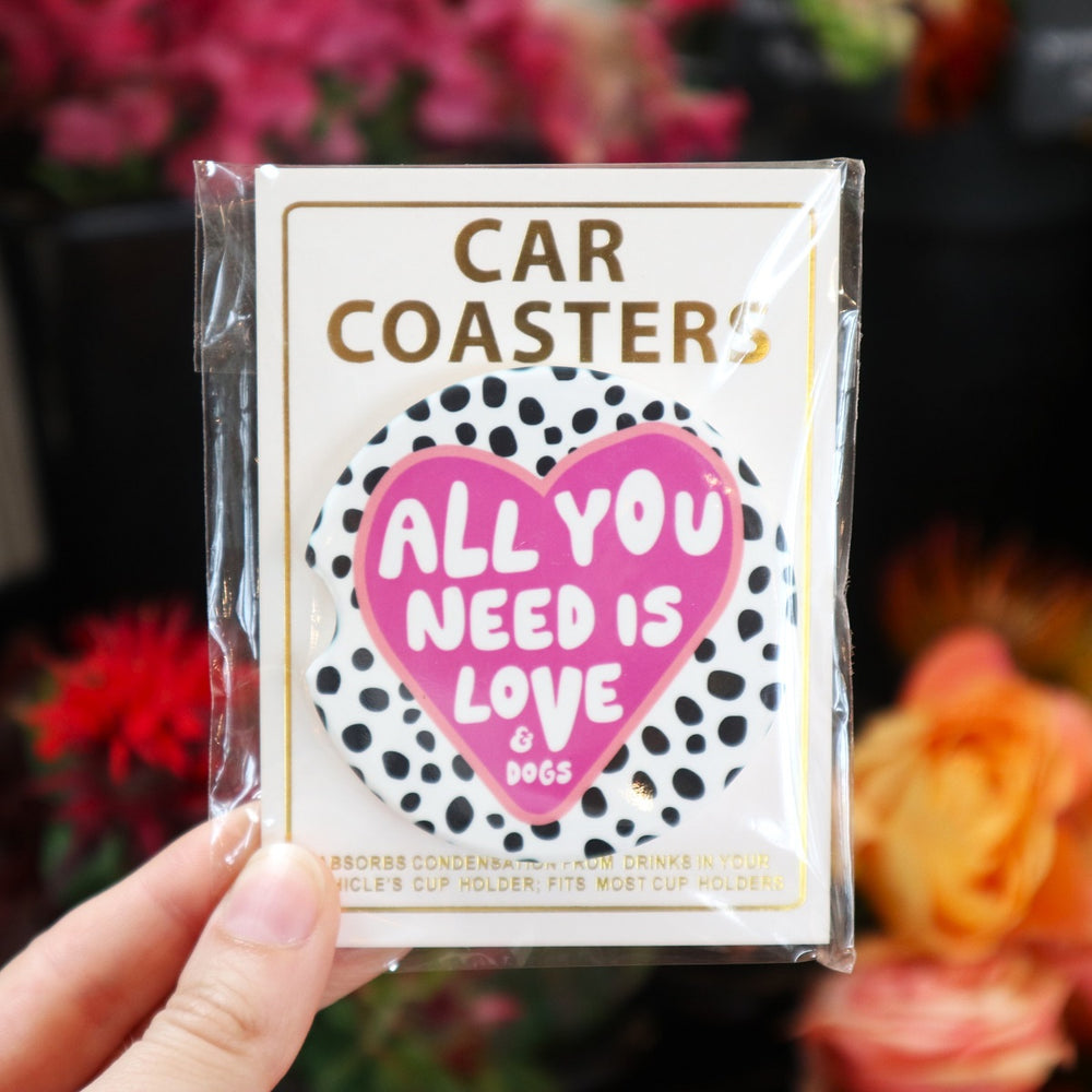 Assorted Car Coasters | All You Need Is Love & Dogs | A pink heart on a black on white speckled background. Text reads "All You Need Is Love & Dogs".