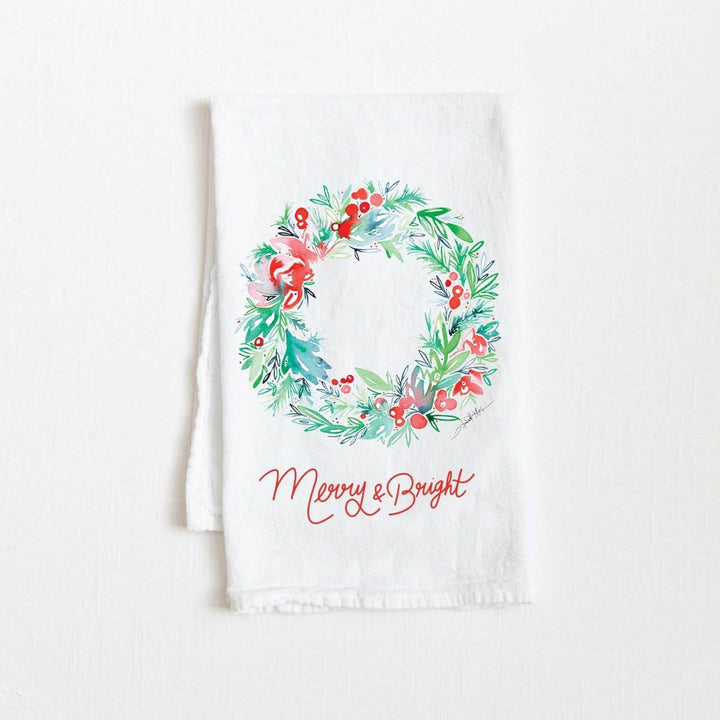 Amanda Klein Co. | Merry & Bright  Flour Sack Towel | a watercolor illustratedwreath with text "Merry & Bright".