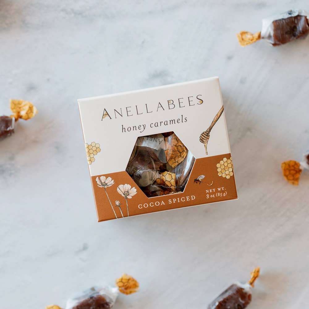 Box of Anellabees honey caramels on a marble surface