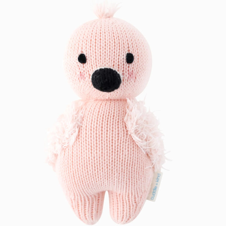 Baby Flamingo | Cuddle + Kind | A soft pink flamingo plush with fluffy wings.