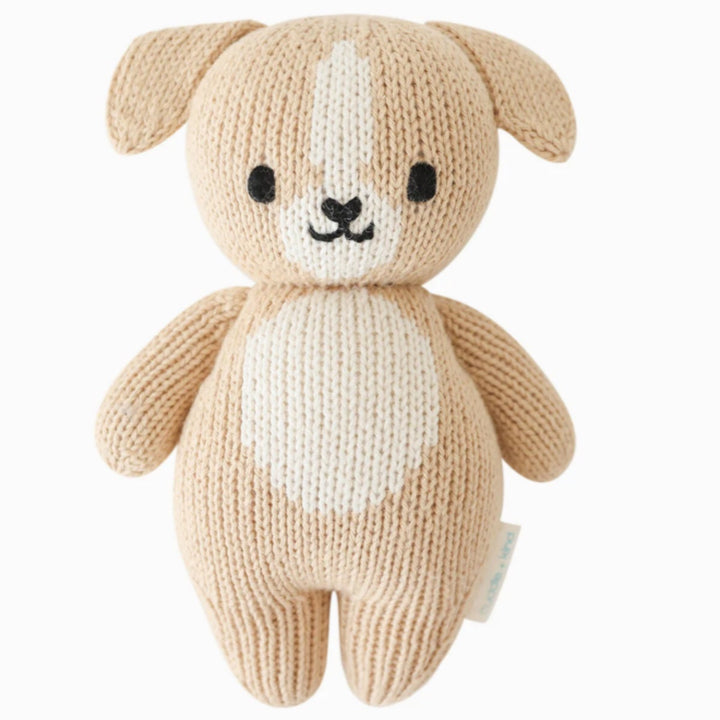 Baby Puppy | Cuddle + Kind | A tan and white puppy plush, hand knit.