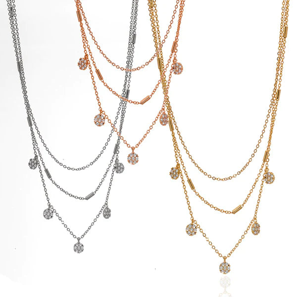 A bedazzled chain necklace with sparkle pendants.