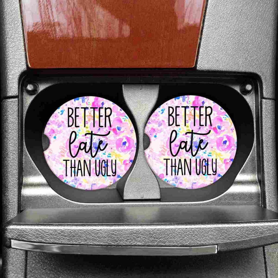 Better Late Than Ugly Car Coasters | A bright pink watercolor design with text that reads "Better Late Than Ugly".