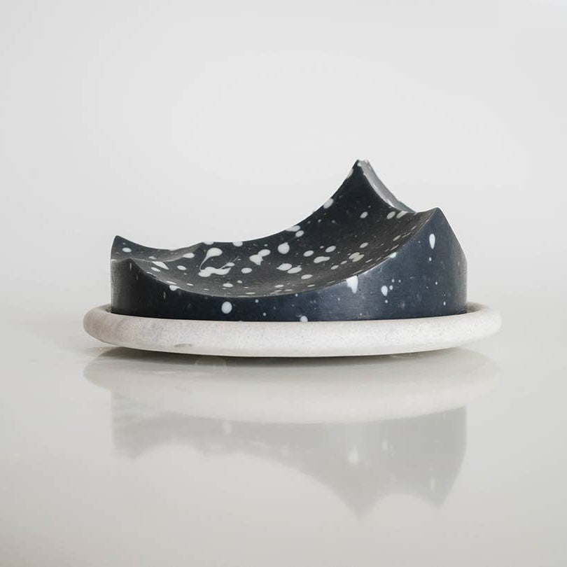 Black and white polka dot shoe on a white background