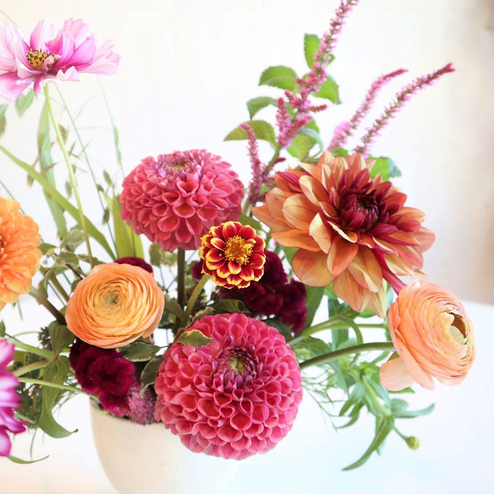 Bountiful | Stacy K Floral | Close up on the pink dahlia, and ranunculus.
