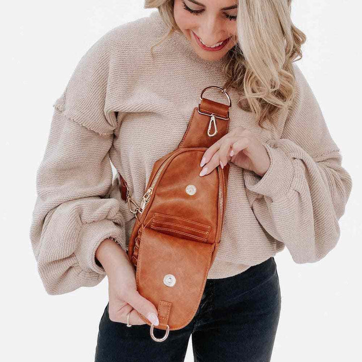 Model displaying the open first pocket with credit card slots.