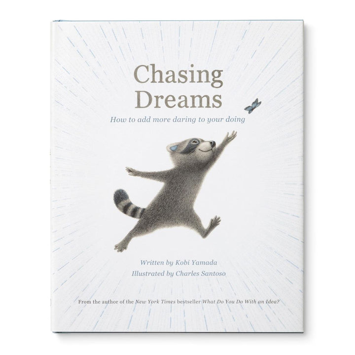 Compendium | Chasing Dreams | The cover shows a raccoon chasing a butterfly. Text reads "Chasing Dreams, How to add more daring to your doing, Written by Kobi Yamada, Illustrated by Charles Santoso, From the author of the New York Times bestseller, What Do You Do With an Idea".