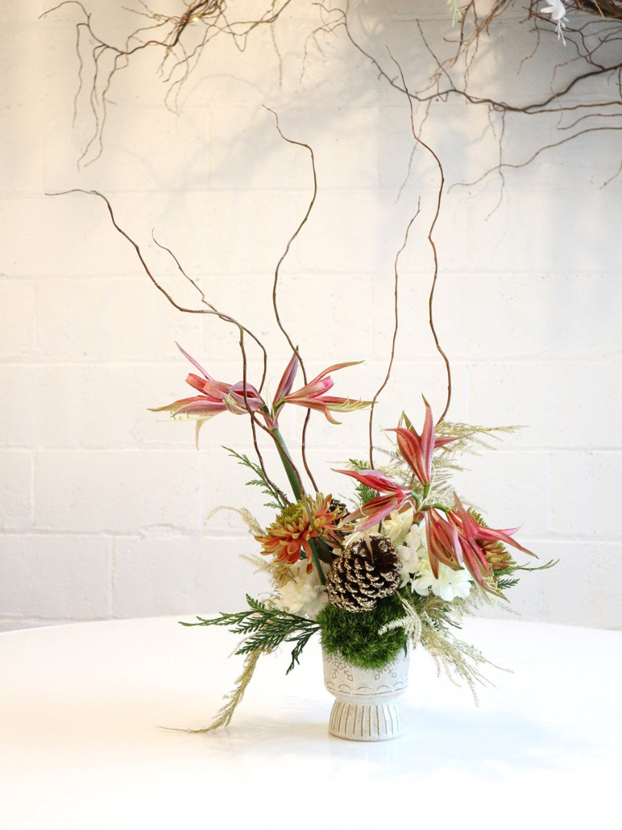 Christmas Spice | Pulled back shot of the arrangement showcasing the height of the branches. Photo taken against a white background.