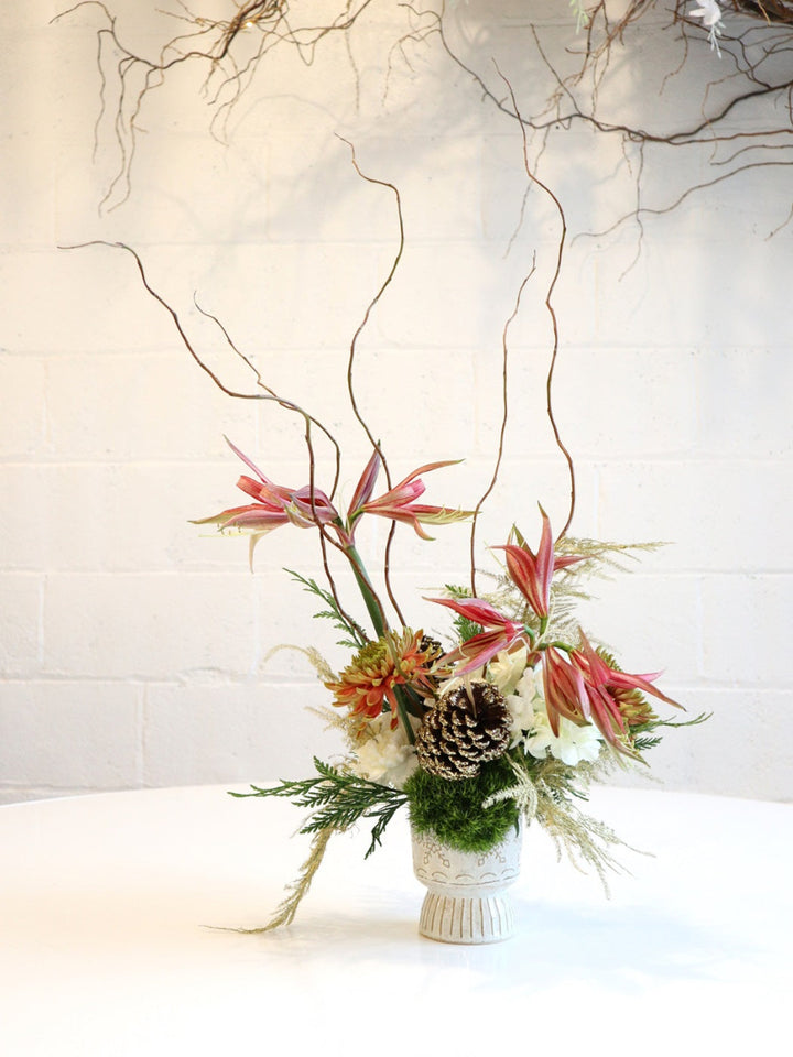 Christmas Spice | Pulled back shot of the arrangement showcasing the height of the branches. Photo taken against a white background.