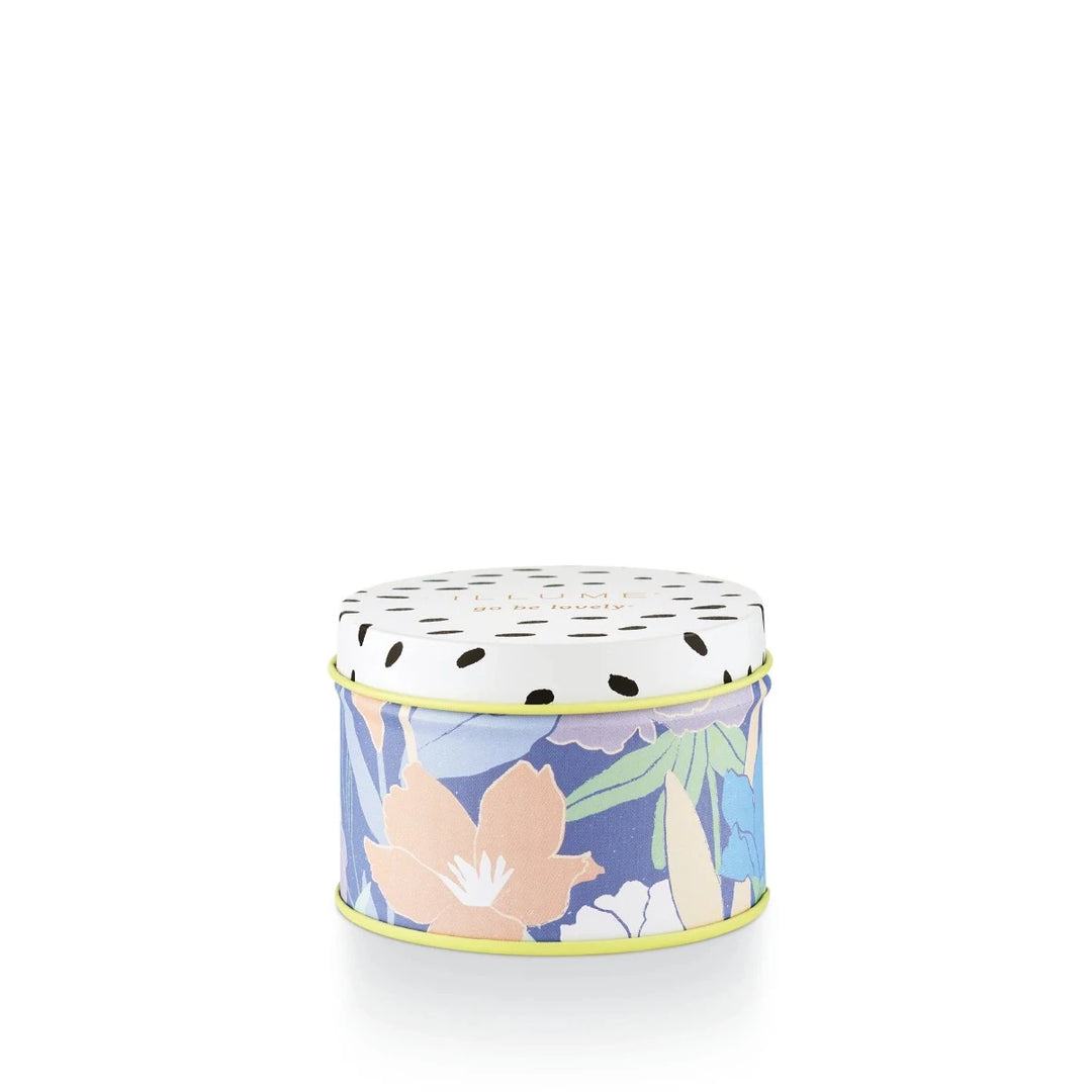 Citrus Crush Fleur Tin Candle | A blue and pastels candle in a tin container.