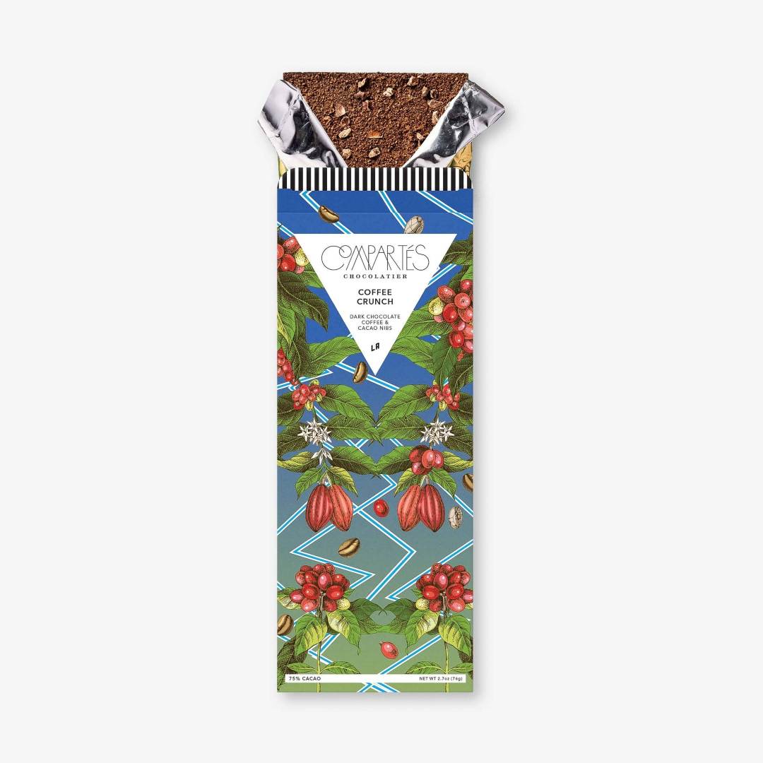 Compartes | Packaged chocolate bar with a colorful label featuring coffee beans and cherries on a white background.