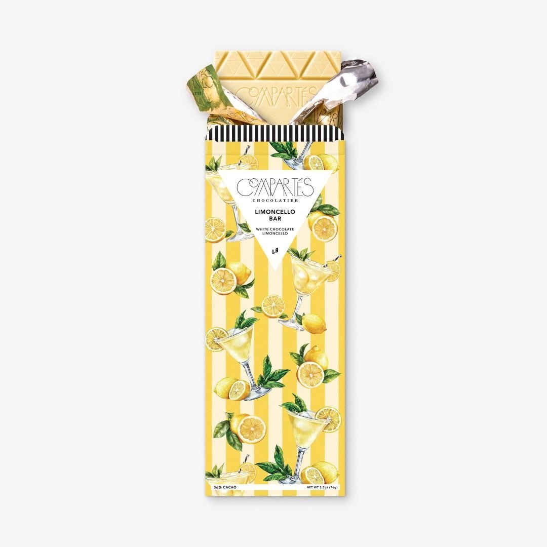 Compartes | Limoncello Bar with packaging featuring lemons and a spoon on a white background
