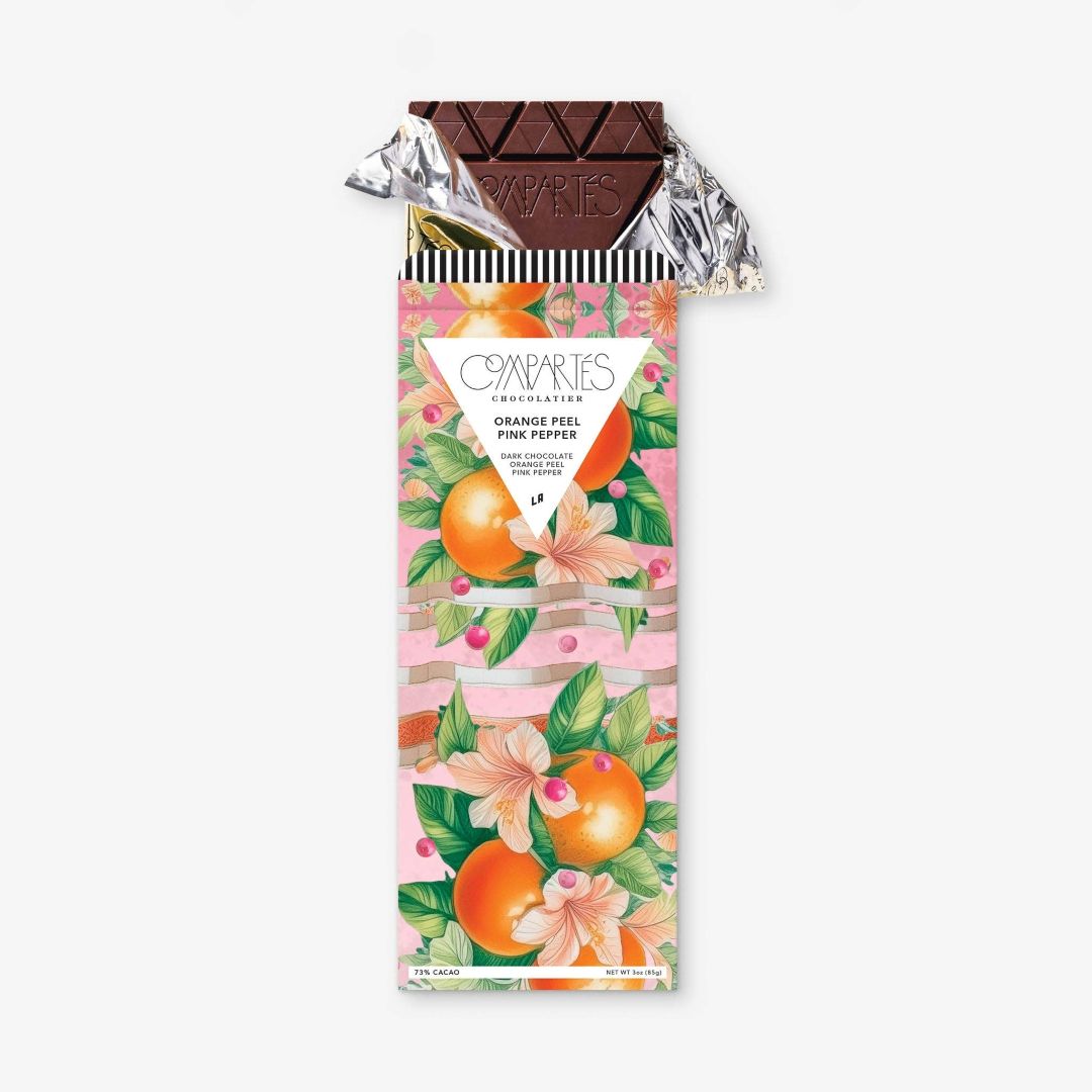 Compartes | Orange Peel Pink Pepper | Chocolate bar with floral packaging on a white background