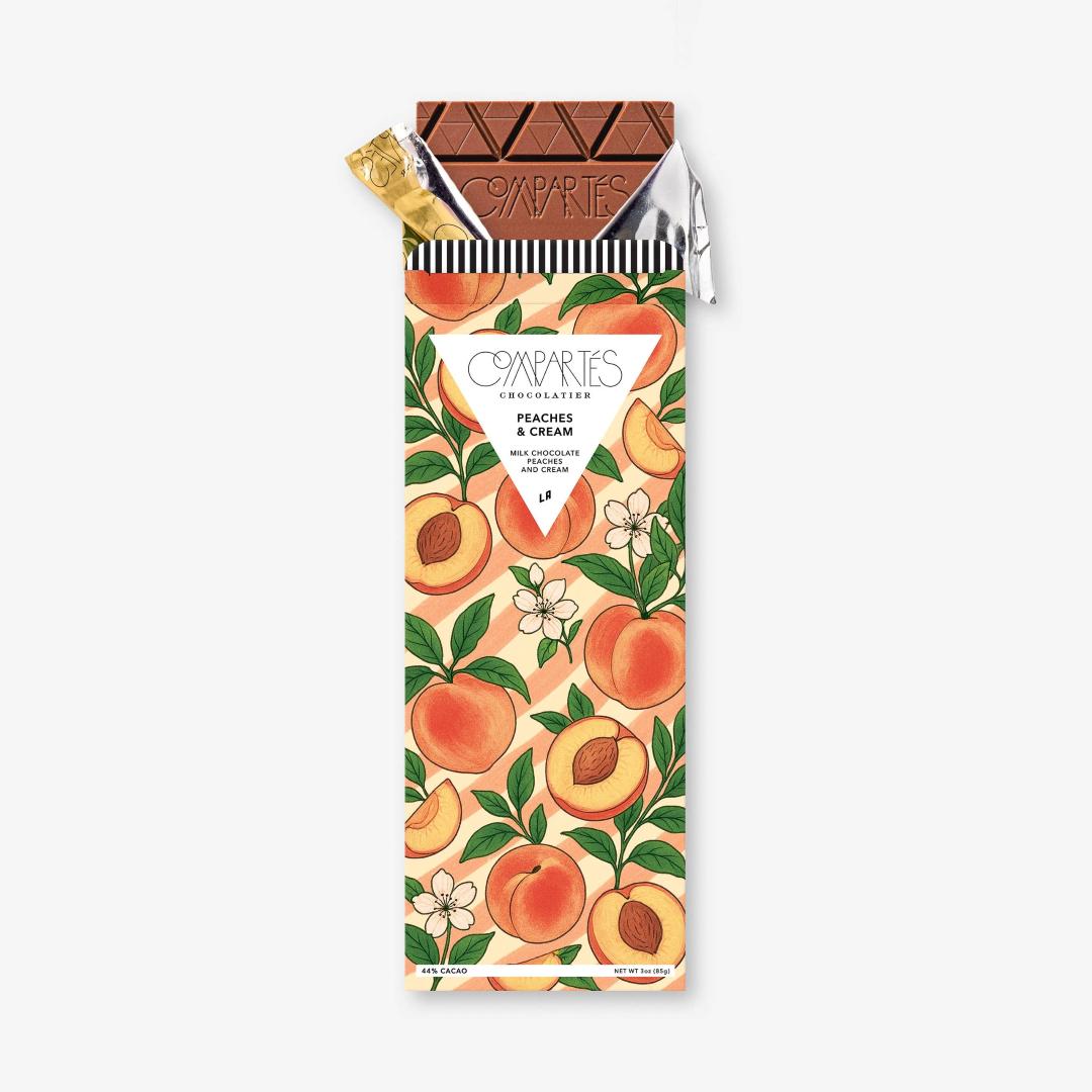 Compartes | Peaches & Cream | Chocolate bar with a peaches and cream design on a white background