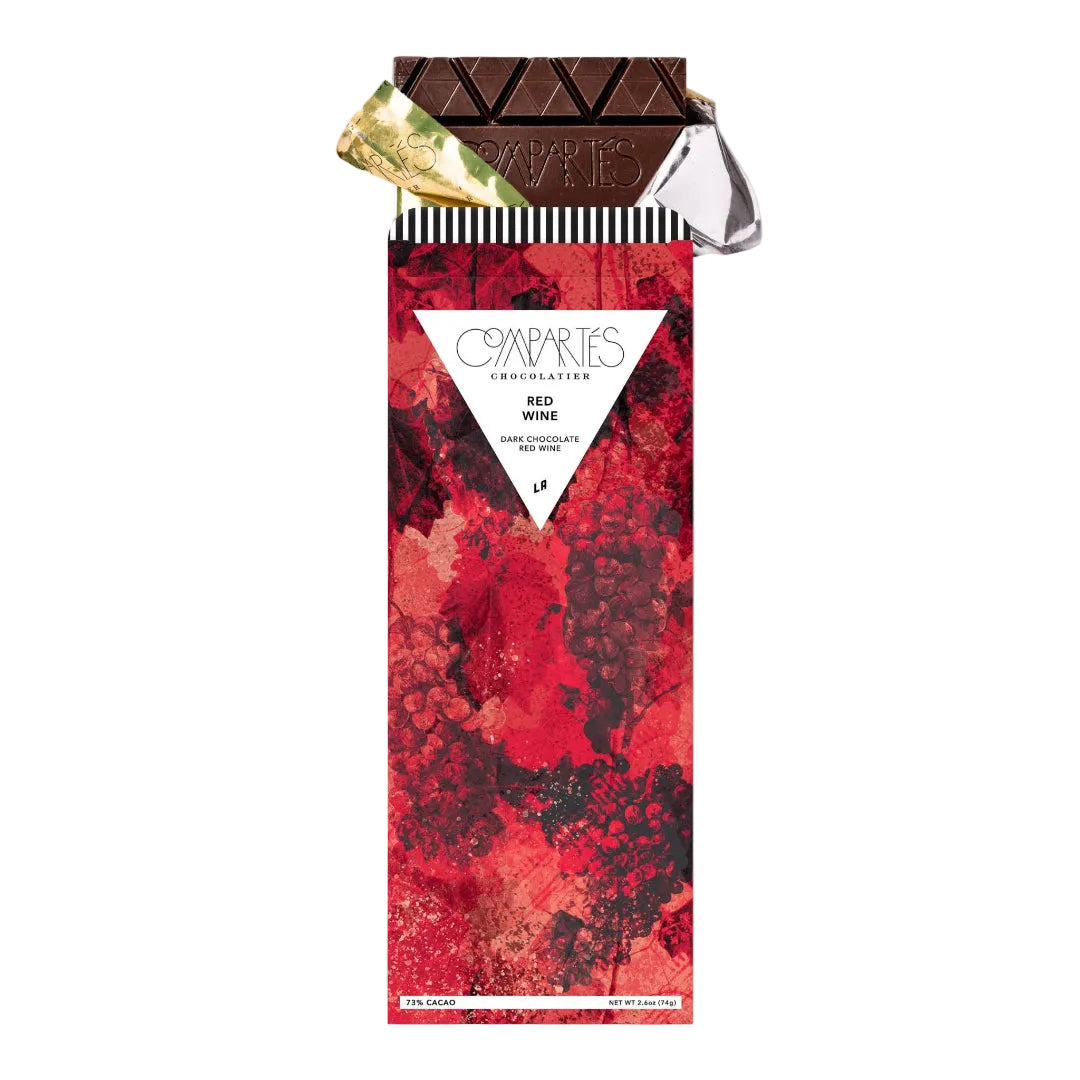 Red wine chocolate bar packaging with a white triangle label on a white background
