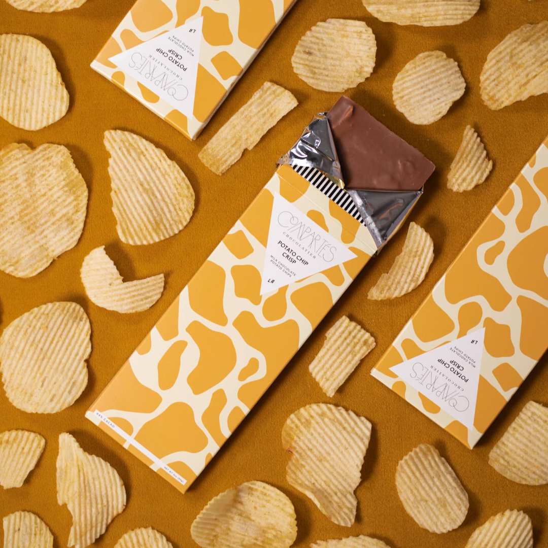 Compartes Chocolate | Potato Chip Crisp | A chocolate bar with potato chips place alongside.