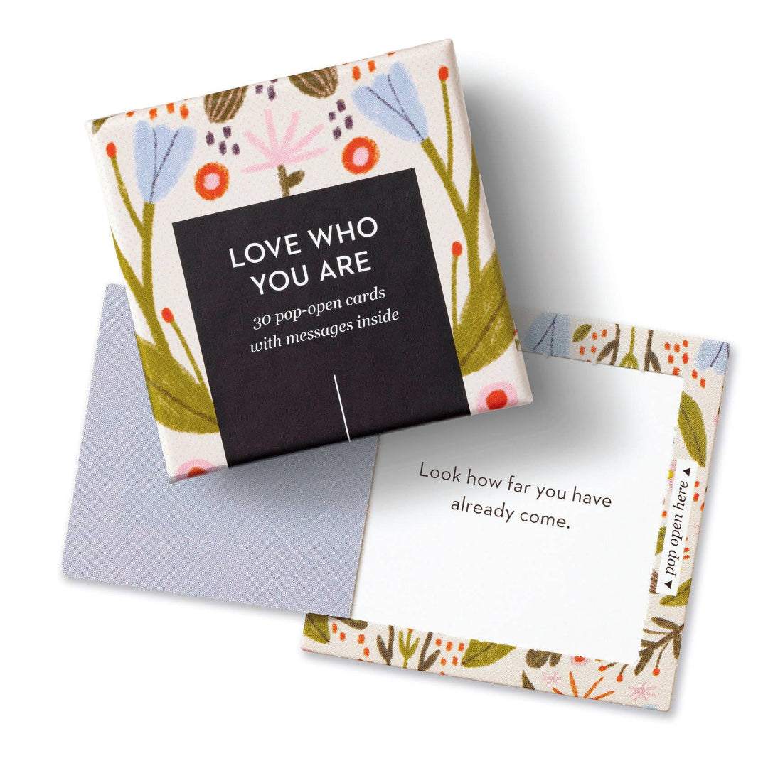 Set of pop-open cards with floral design and motivational text on a white background