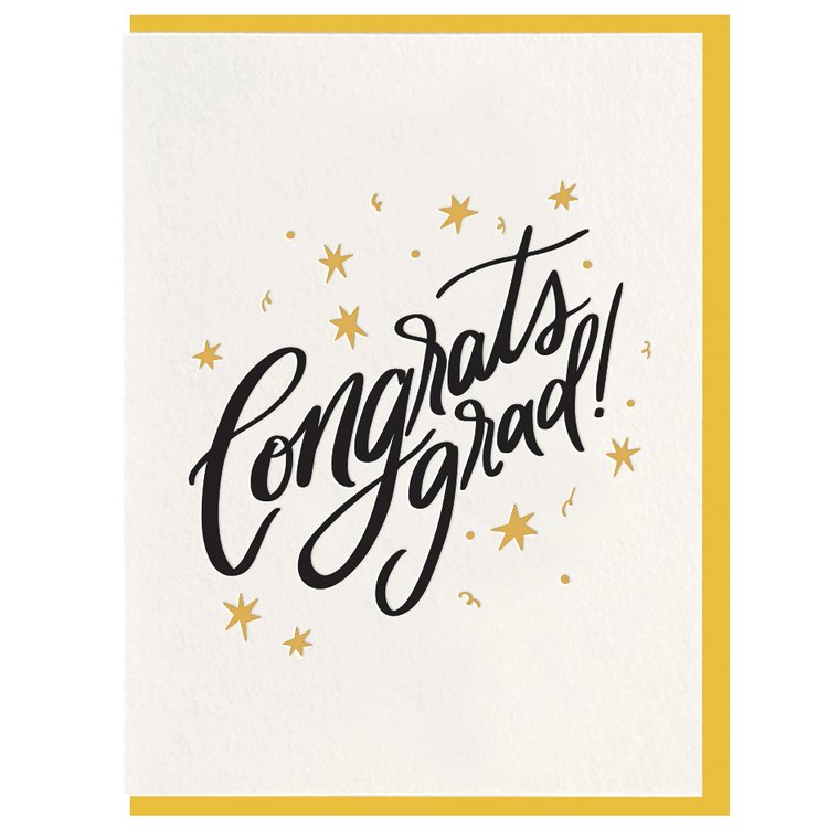 Congrats Grad! | A white card with "Congrats grad!" in black cursive text, decorated with gold stars and mini confetti. Comes with a yellow envelope that matches the stars.