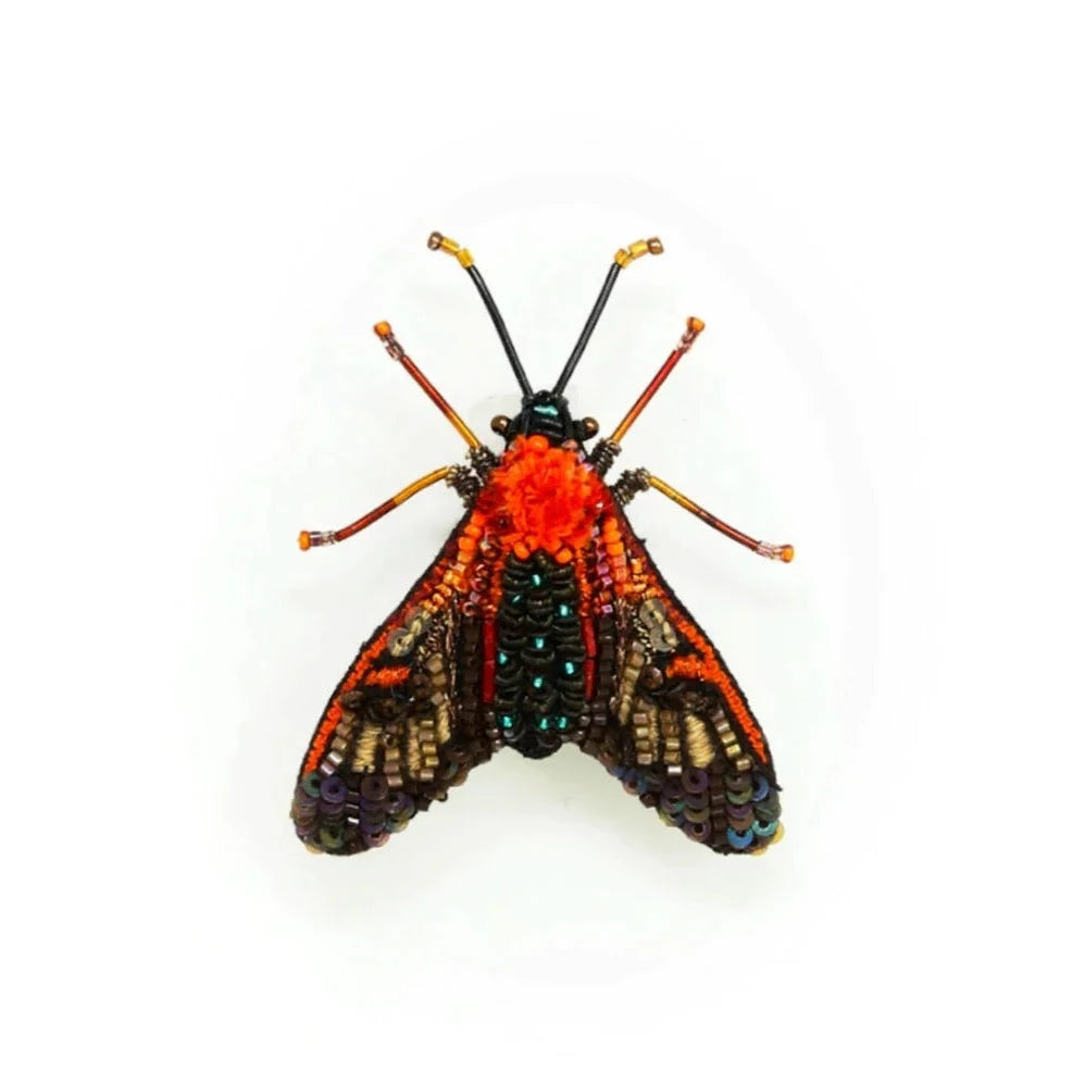Cosmos Moth Brooch | A orange and black cosmos moth brooch, handmade and hand embroidered with beading.
