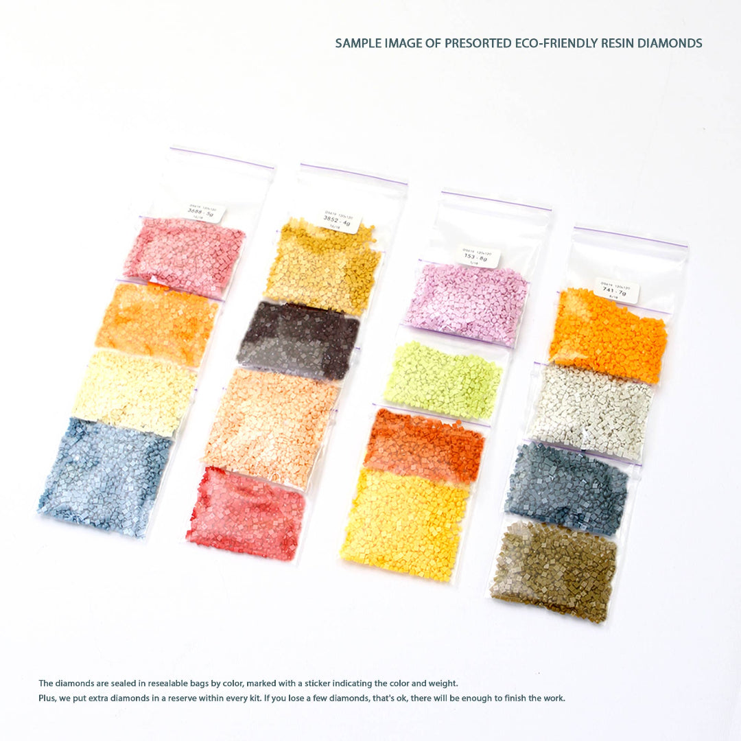 Packaged eco-friendly resin diamonds in various colors on a white background