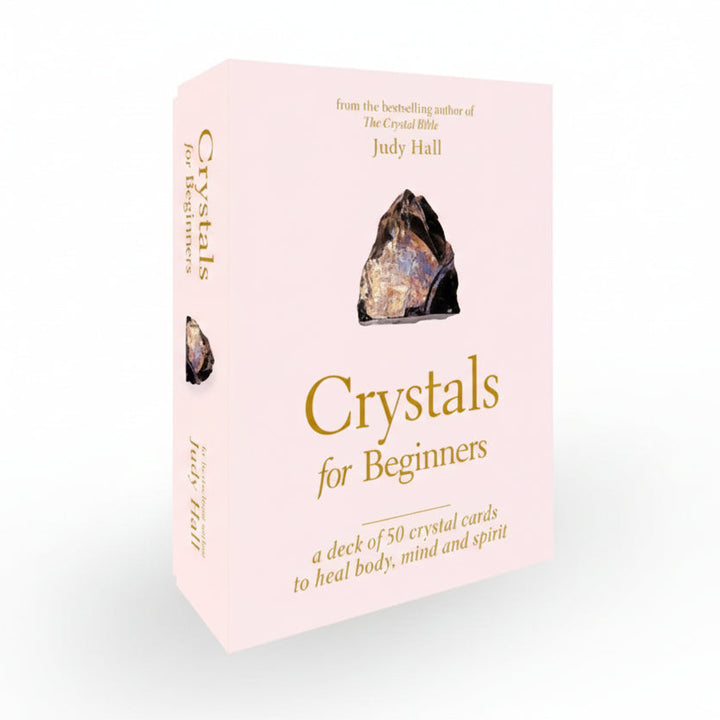 Card deck packaging for 'Crystals for Beginners' by Judy Hall on a light gray background