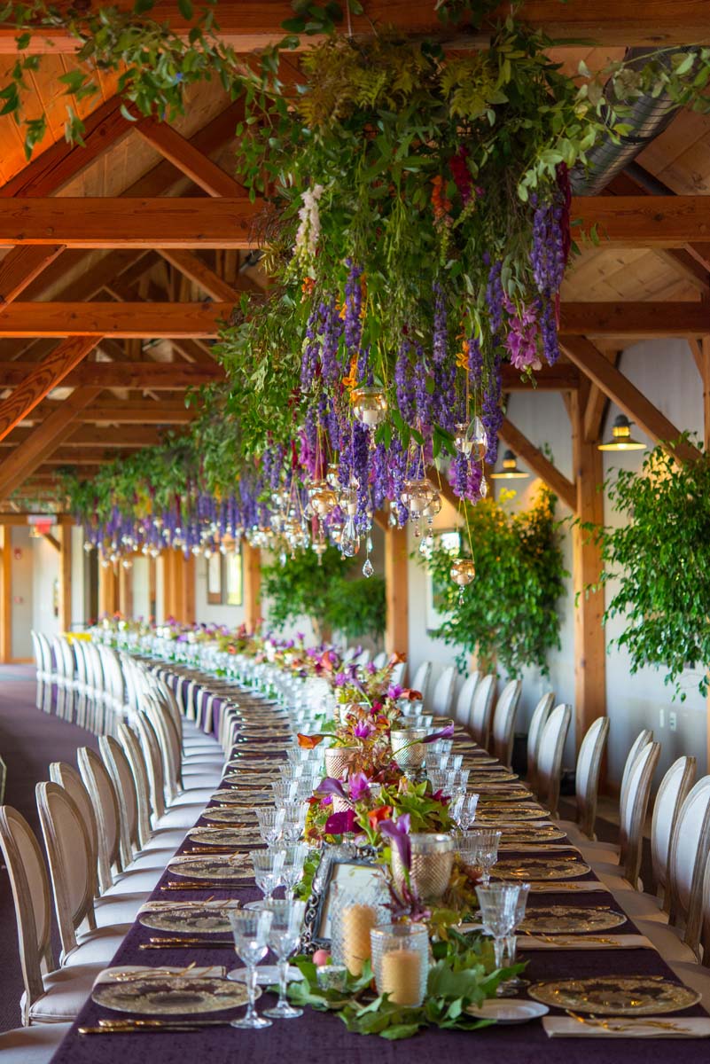 80 foot long hanging centerpiece at the welch allyn lodge on curved tables