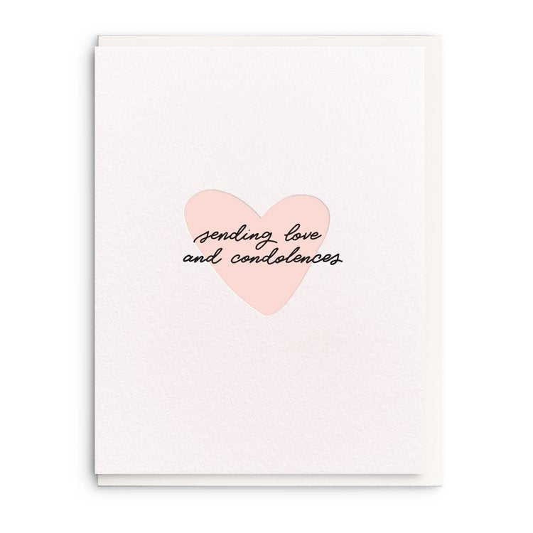 Dahlia Press | Sending Love and Condolences | A white card white a single pink heart in the center.