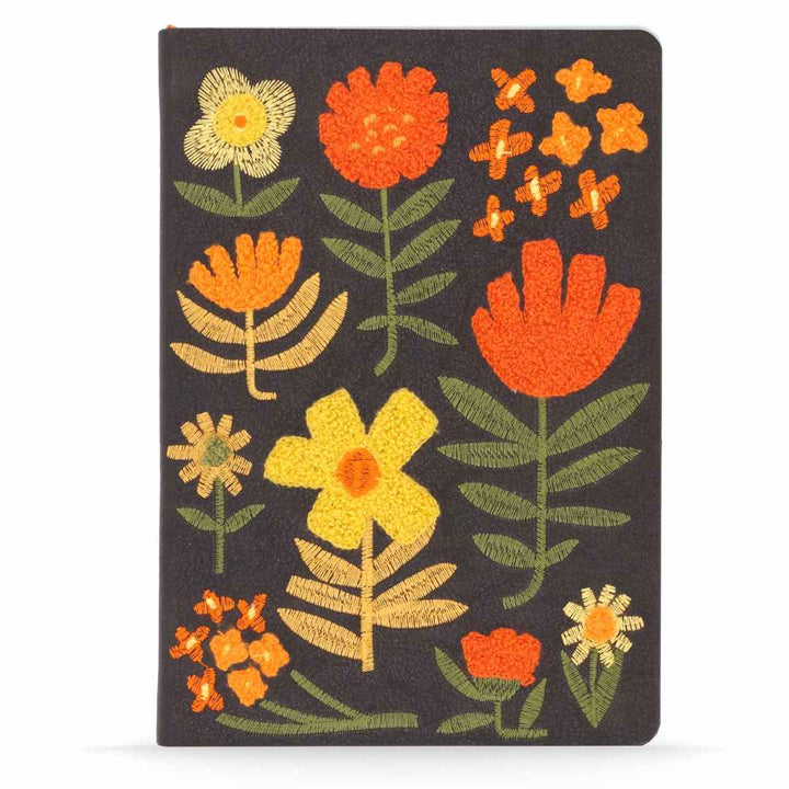 Denik | Embroidered Journal | Black background with orange and yellow embroidered flowers.