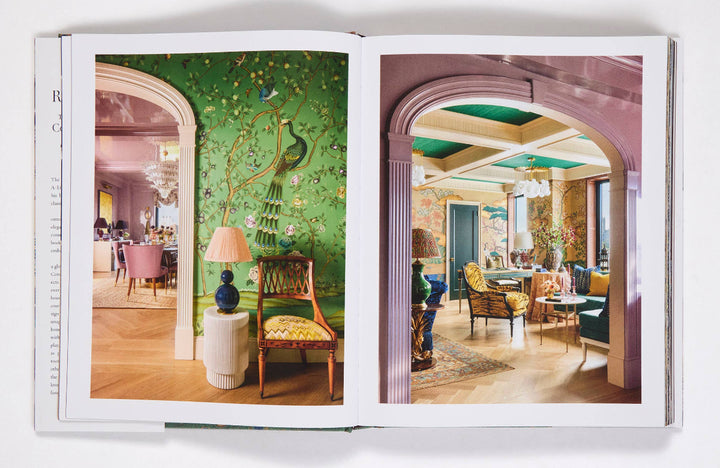 Open book showing interior design images with chairs and decor.