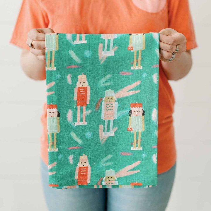 Doe A Deer | Nutcracker | Full Pattern Towel | a mint green towel with a nutcracker figurine pattern.