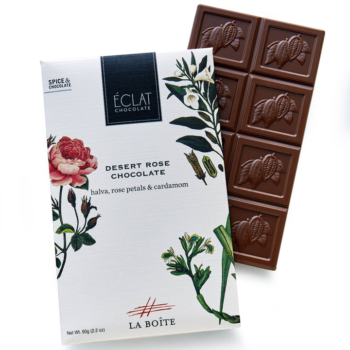 Chocolate bar with packaging featuring floral design on a white background