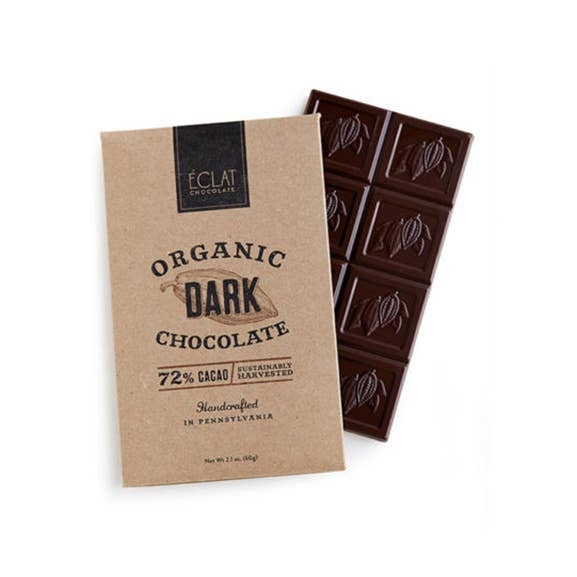 A package of Eclat Organic Dark Chocolate 72% cacao, showing the kraft paper wrapper alongside a dark brown chocolate bar on a white background.