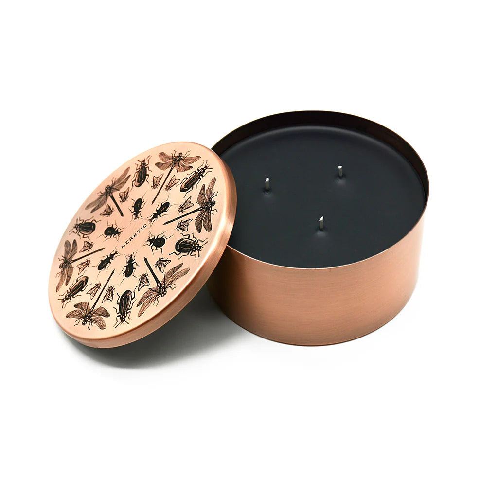 Heretic Parfum | The Entomologist Candle | A black candle in a copper tin with a bug design on top. Three wick candle. All natural bug repellent.