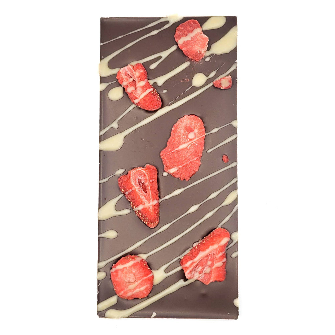 Chocolate bar with raspberry pieces and white drizzle on a white background