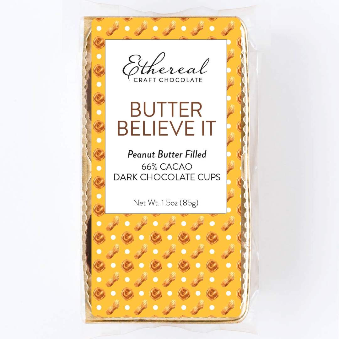 Ethereal Craft Chocolate Butter Believe It packaging on a white background. Peanut butter filled, 66% cacao, dark chocolate cups.