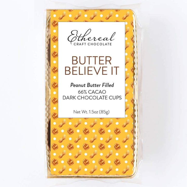 Ethereal Craft Chocolate Butter Believe It packaging on a white background. Peanut butter filled, 66% cacao, dark chocolate cups.