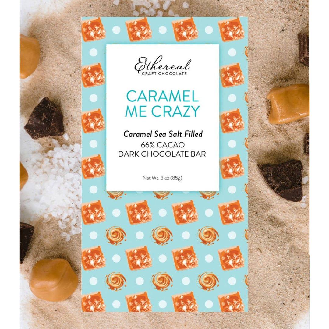 Ethereal Craft Chocolate Caramel Sea Salt Filled Dark Chocolate Bar packaging on a chocolate background.