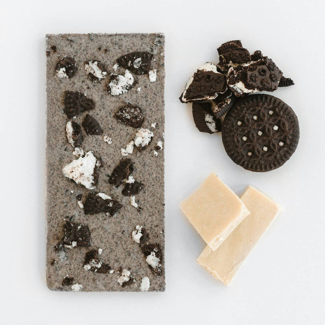 Oreo-themed soap bar with Oreo cookies and cream on a white background
