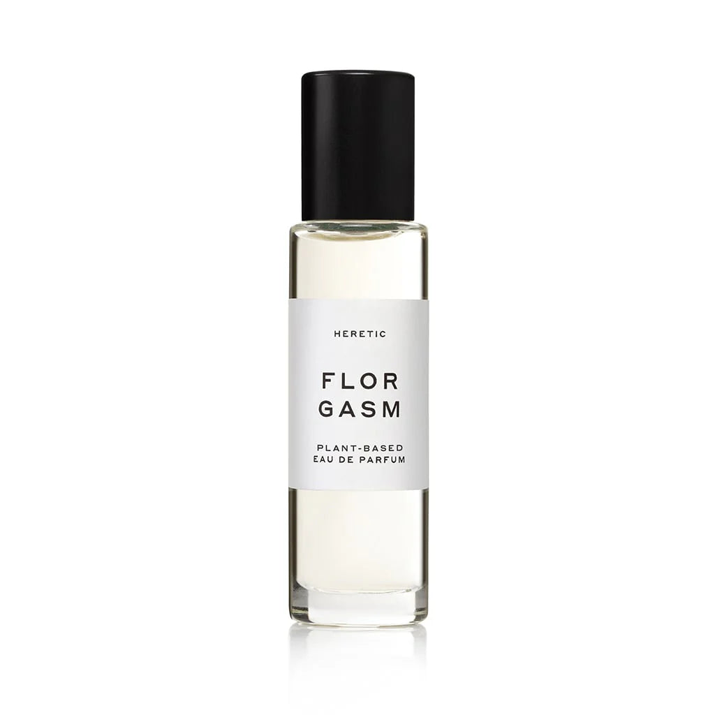 Heretic Parfum | Florgasm | A transparent perfume bottle with a white label and black accents.