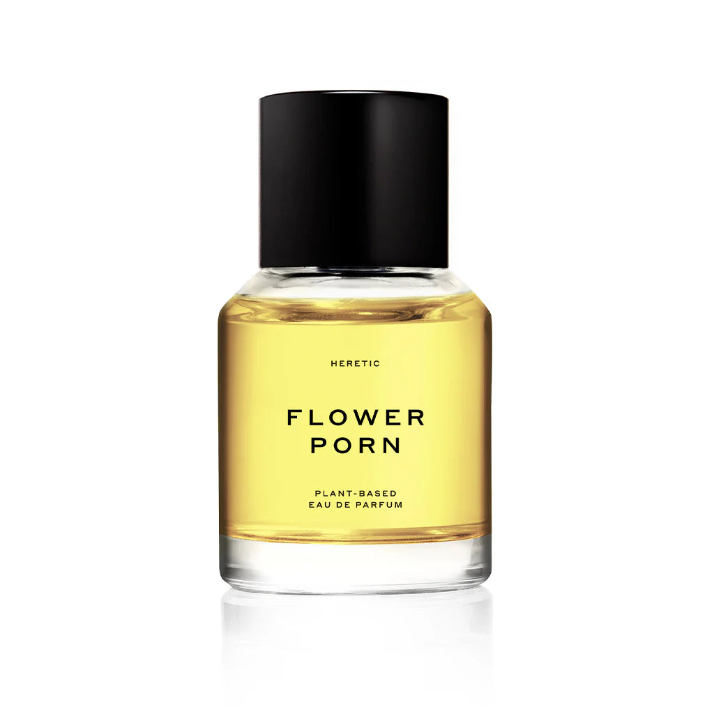 Heretic Parfum | Flower Porn 50 ML | A small transparent bottle with perfume inside. Text reads "Heretic, Flower Porn, Plant-Based, eau de parfum".