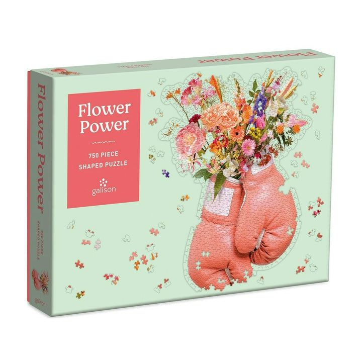 Flower Power Puzzle | A mint green box with a photo of the puzzle on the from. Pink Boxing gloves with florals coming out the wrist. 750 piece puzzle.