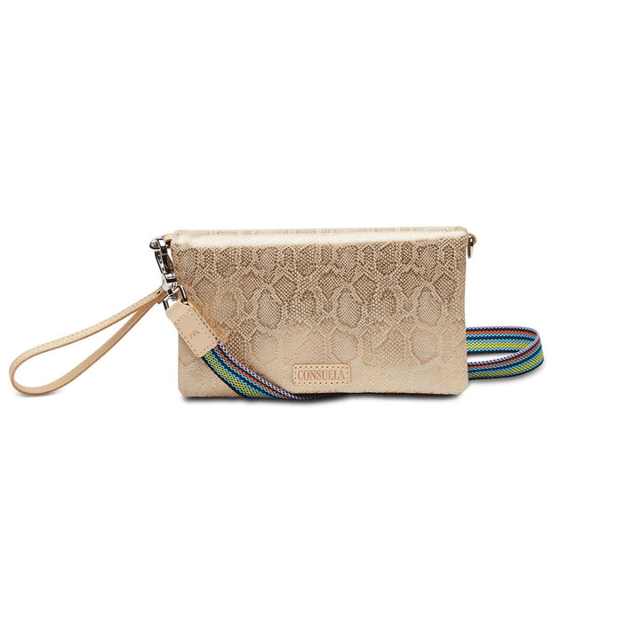 Gilded Uptown Crossbody | Consuela | A golden snake skin patterned crossbody bag with a wrist strap and a multi colored crossbody strap.