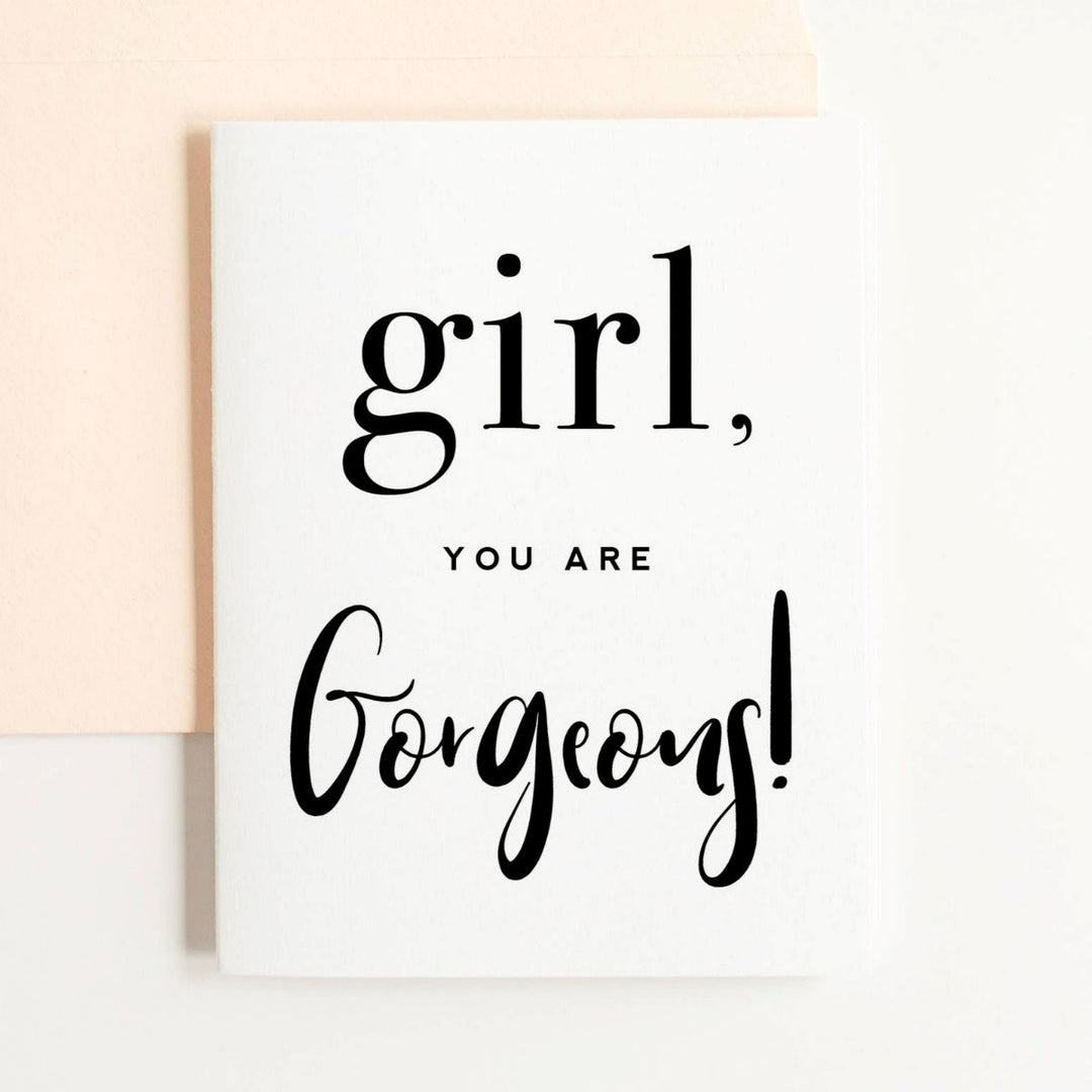 A simple white card with black text that reads "girl, you are gorgeous!".